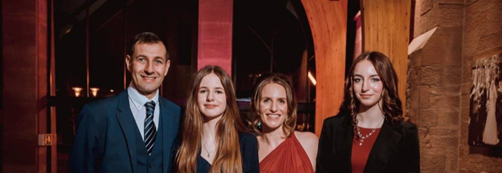 A group of people posing for a photo

Description automatically generated
